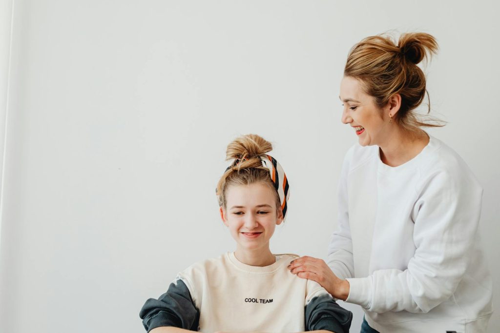 Woman Wearing Headband Laughing with a Friend